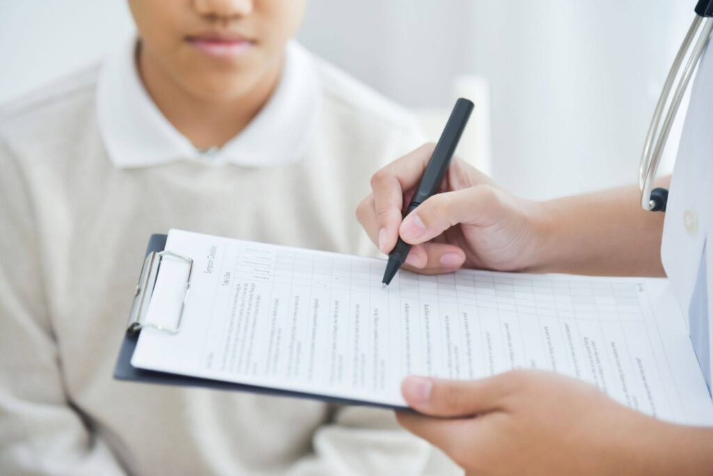 BCBA reviewing an ABA reassessment report against a pre-submission checklist